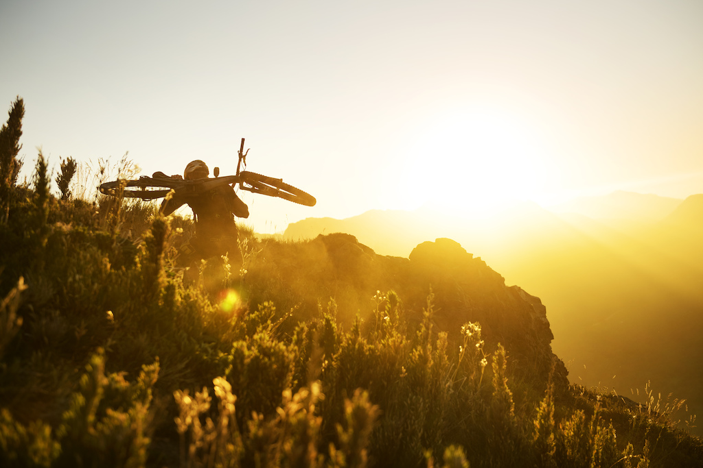 Tomas Slavik hikes the hill with his enduro bike during his training for the first race of City Downhill World Tour on 13th February 2015 in Nevados de Chillan, Chile