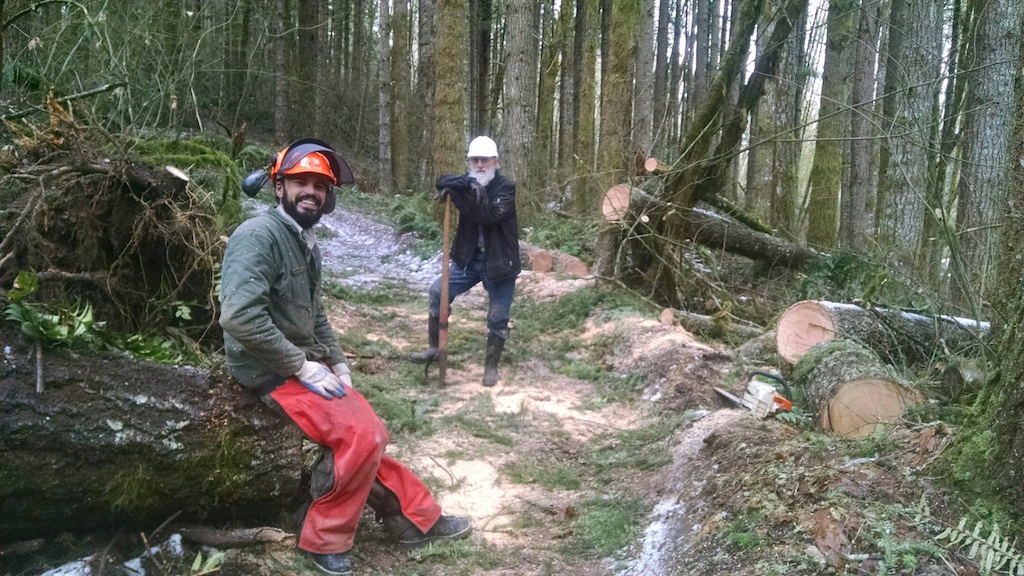 Ranger Blair and park camp host out clearing downed trees on Drip Torch at Stub Stewart State Park