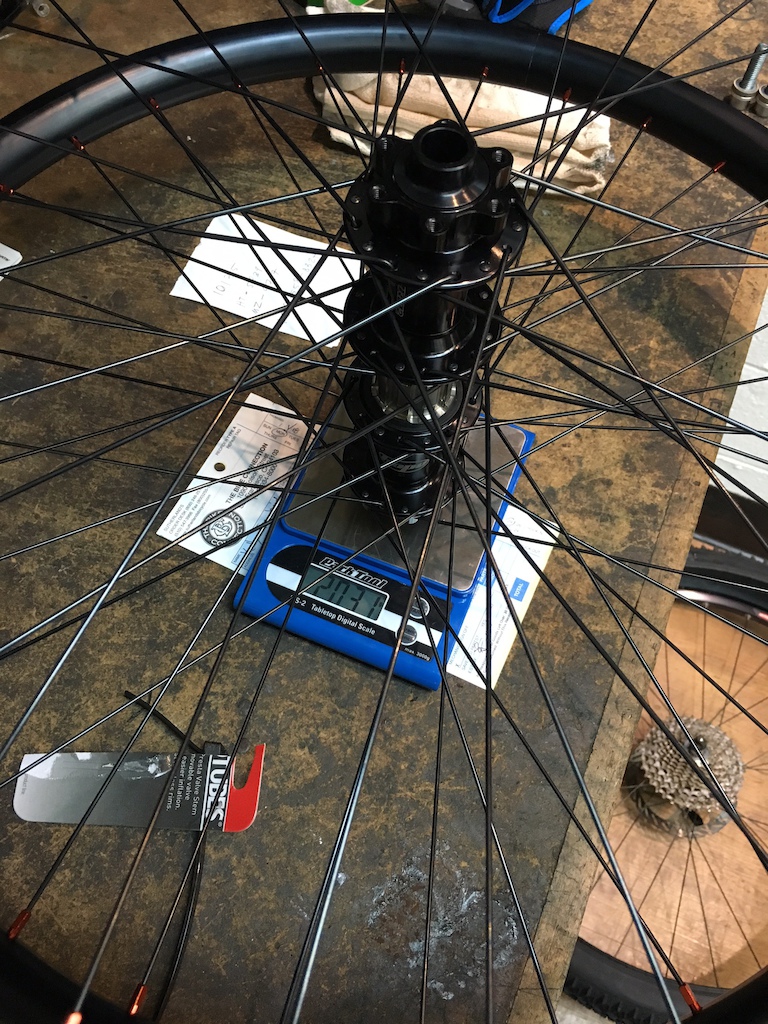 Complete wheelset weight, without axle bolts or rim strips. Not too bad for a pretty solid setup. 4.47 lbs for you 'Mericans.