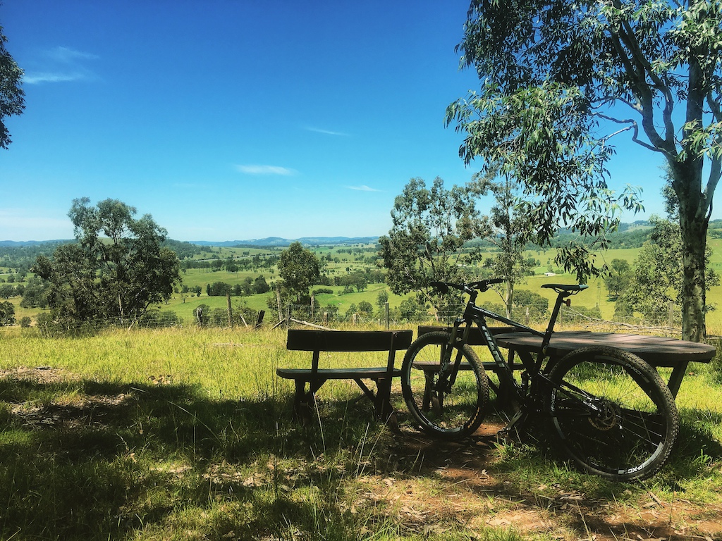 This is one of a couple of high points with views in The Dungog Common. Several trails meet at this point including Firetrail Sprint and The Bowlo with the Snake Track taking off along the fence in the rear of the shot. Great spot for a break.