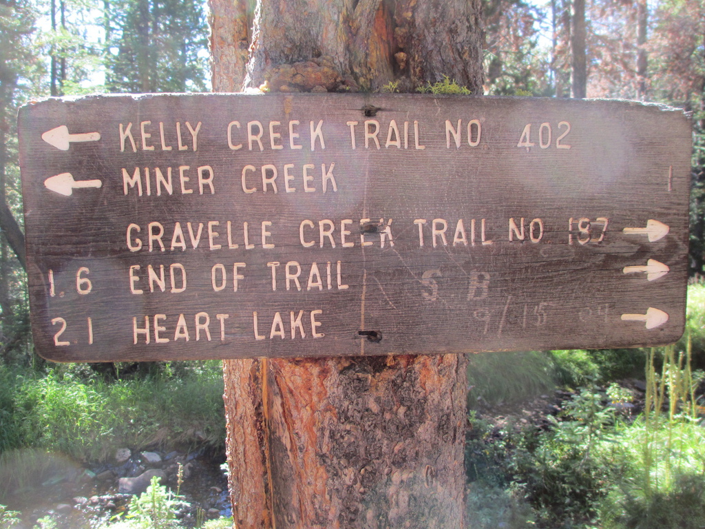 Sign at junction of Kelly Creek Trail and Gravelle Creek Trail. Note end of trail 1.6 miles.  That is far short of Heart Lake.