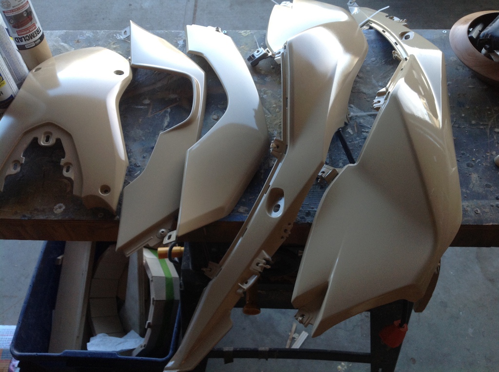 My moto plastics. Well, some of them. I was a little nervous pulling all the trim off my bike, as it's not cheap, and already looks good. Sanding taping prepping them with a tan primer has more than a few raised eyebrows, but I'll show them! It will be rad!