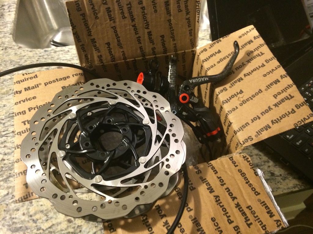 Used set of Magura MT8 brakes with 180mm rotors.   Cleaned up to new appearance with some soap &amp; water detailing.  Brakes are so light, but the 2-pc rotors weigh a ton.  Seems like the centers are steel rather than alloy?  Might have to order a pair of new Storm SL rotors instead.