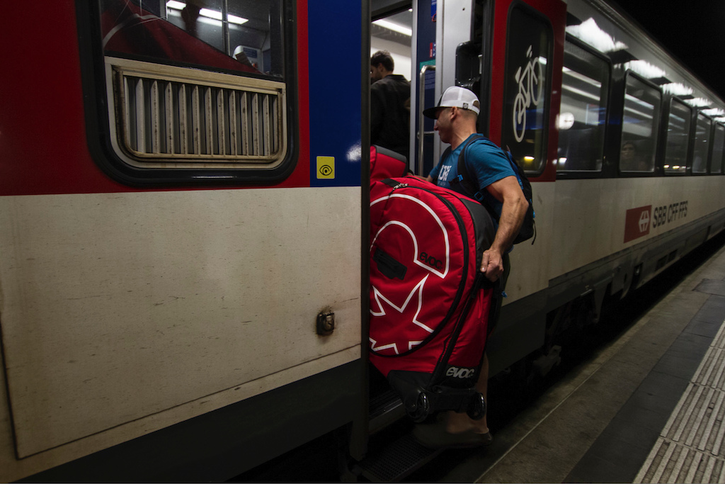 Brice Shirbach loads his bike bag onto the CFF train to Zermatt after landing in Geneva. Switzerland s public transit system is dialed beyond belief and we took it everywhere. Ryan Dunfee photo.