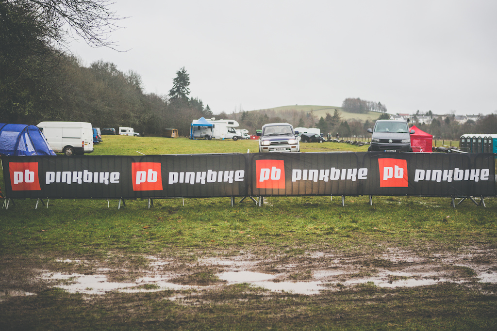 Pinkbike banners standing strong against the wind.