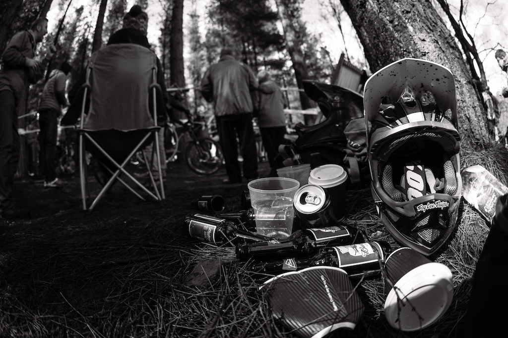 Evidence of mountain bike spectators: Helmet, coffee, beer.