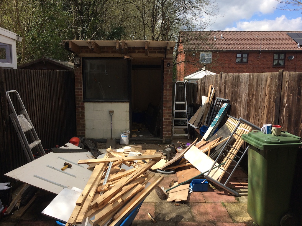 demolishing the brick shed..