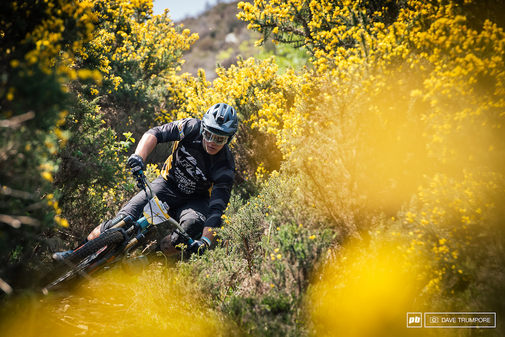 Loose rock, mud, and sharp prickly bushes are no deterent for Richie Rude.  He'll just smash the corner anyway.