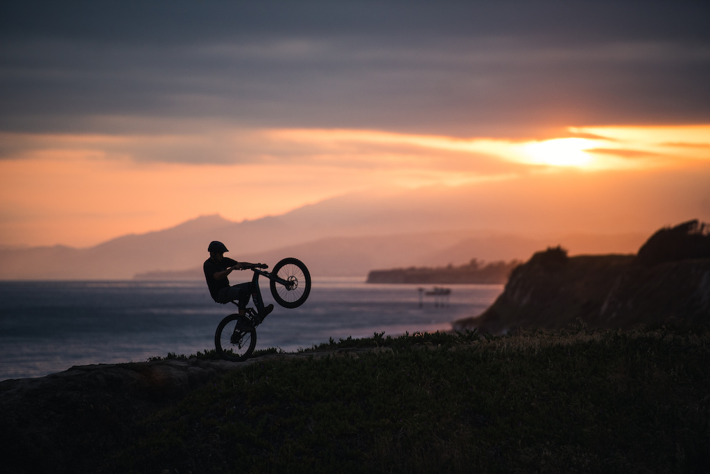 Nelson's wheelie skills on fine display in front of a particularly spectacular sunset on the Santa Barbara coastline.