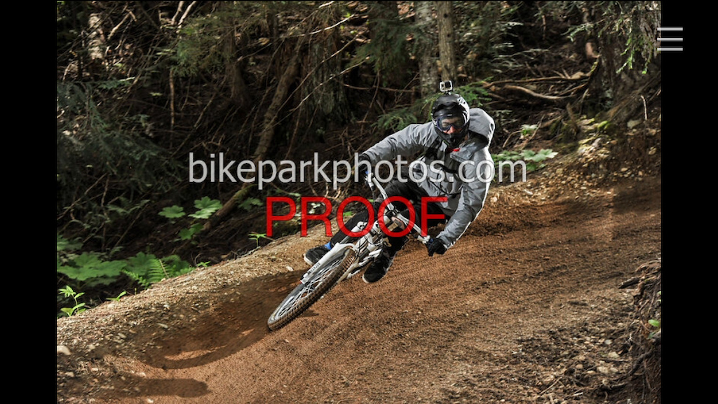 Railing berms and winking at trailside photographers, all in a days work.