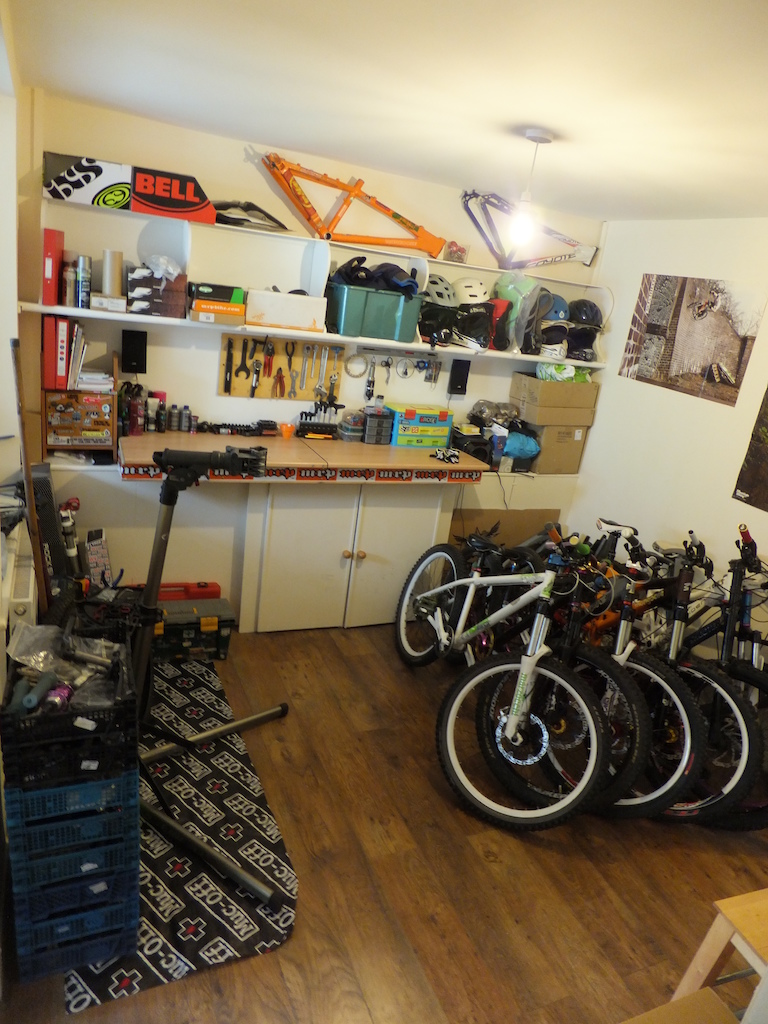 Finished building my new workshop.
Complete with mtb posters, MRP race tape and custom made shelfing units for parts/gear.