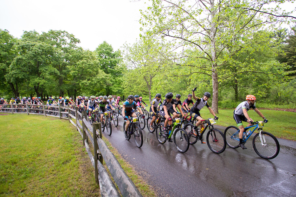 The peloton rolls out for the fifth and final time at the NoTubes Trans-Sylvania Epic. The rain held off for the start, but a 45-minute deluge drenched racers and trails mid-stage, making the rocks even more challenging than usual.