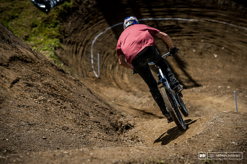 Tommy G stomping the pedals of his canyon down into the wall-berm.
