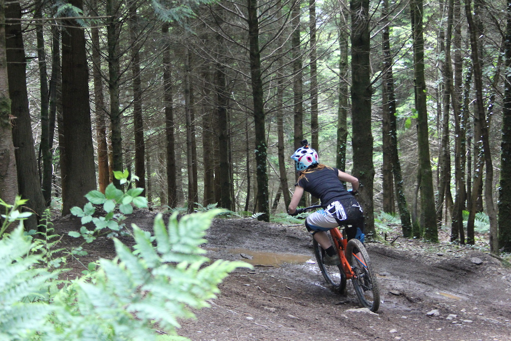 Rocky mountain Rider Laura Griffiths getting loose into the berms on Supertavi