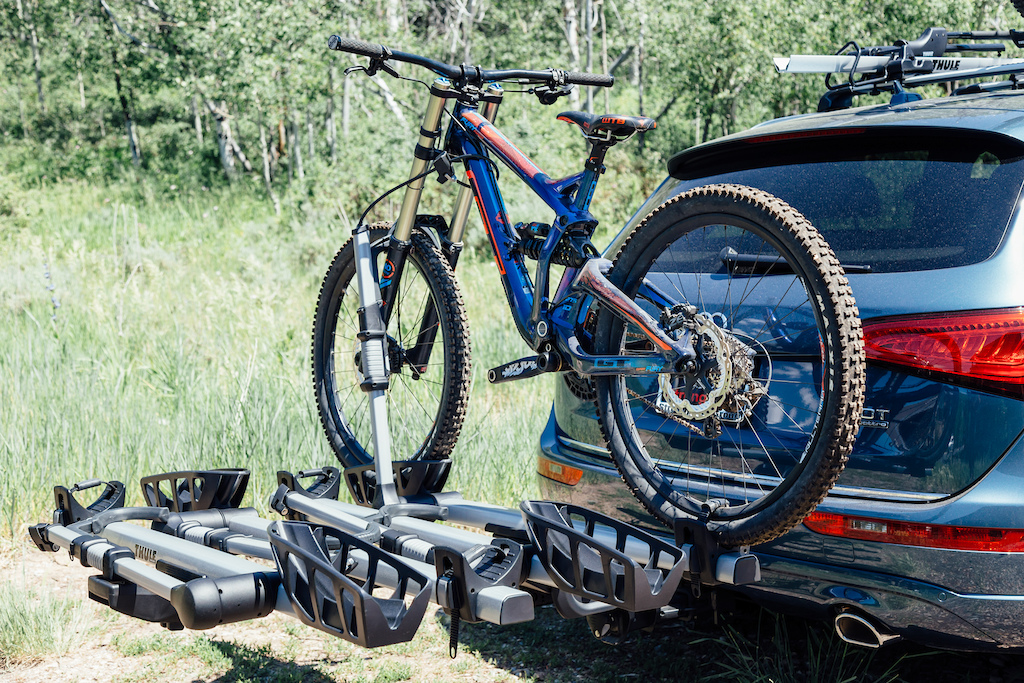 The updated Thule T2 Pro rack can hold 4 bikes up to 50lbs each (with a 2" hitch). It includes a lock on each front locking mechanism. The 1.25" hitch is only available in a 2 bike configuration. MSRP is $549.95 US