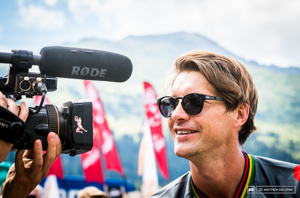 Is Greg smiling because he's notice the lens hood on this camera, or because he's stoked on another trip to the podium.
