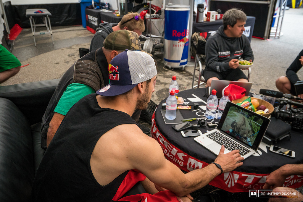 Gee going over GoPro footage  before his race run to figure out where he can save some time.