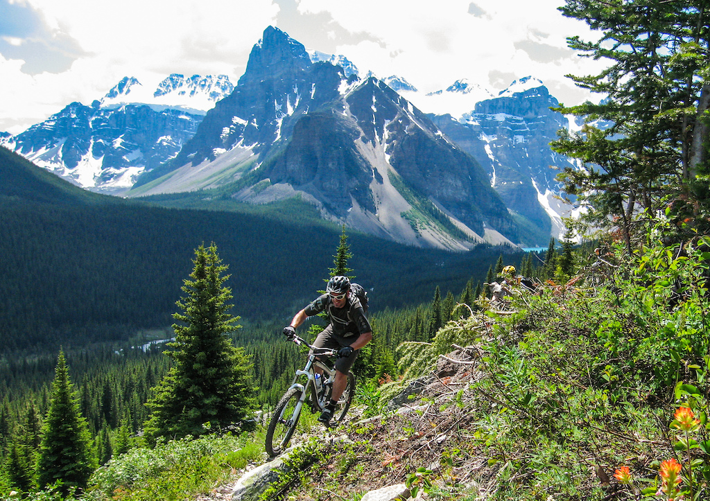 Blue in his element: singletrack and spectacular scenery on the Highline above Moraine Lake, Alberta.