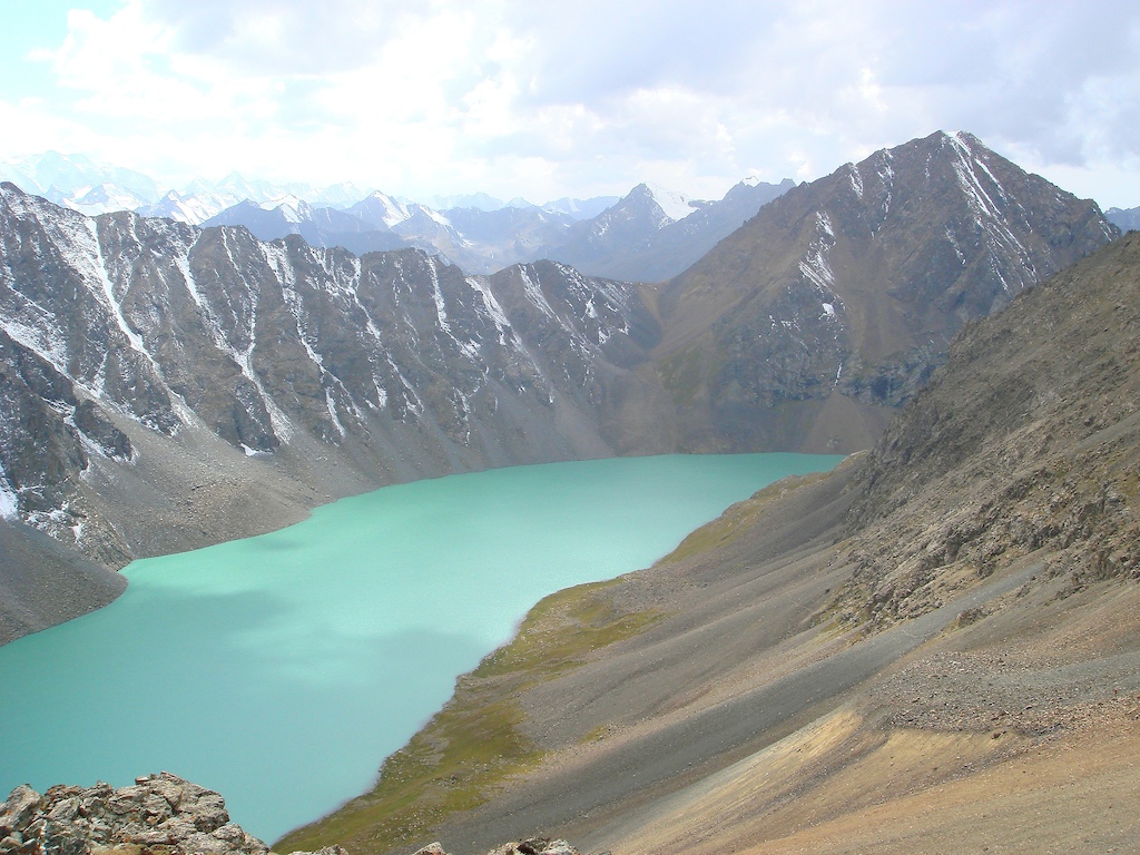 Photo taken at the saddle, looking down at the lake.  The faint singletrack through the talus visible on the right.