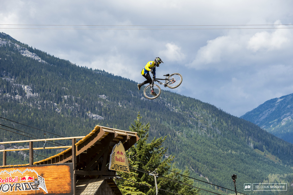 Max Fredriksson walking on air as he double tail whips the off the Redbull House midway down the course.