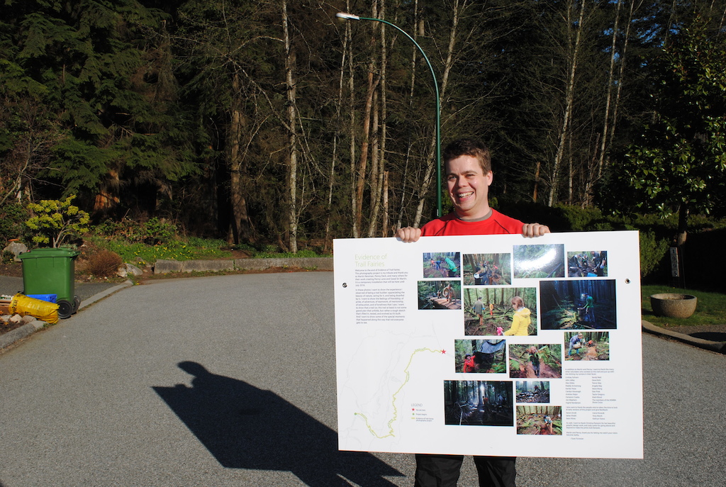 Excited to see the info posters for the first time! It took 6 trips to hike everything in. Until we were ready to put it all up, I kept everything hidden off the trail in black garbage bags to make it harder to spot and to protect it from the elements. Photo by Kathryn Toews.