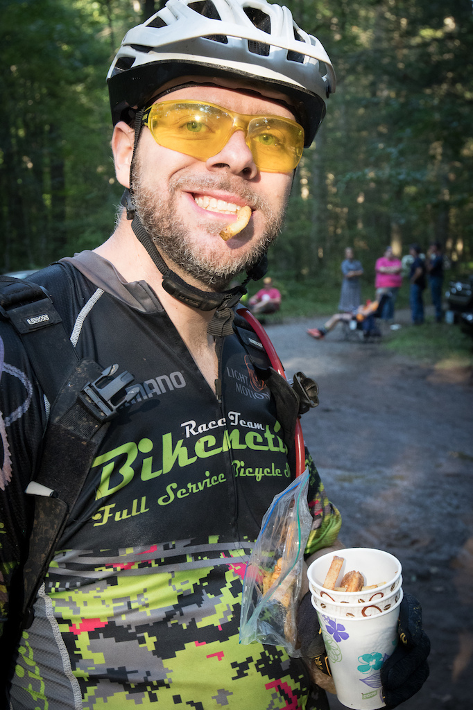 Dane Paris enjoys the legacy of Scott Scudamore at aid station #6. The CAMBC crew cooked up fresh batches of ScudFries all afternoon and into the evening for the riders. #Shenandoah100 #Stokesville Photo by Will Niccolls www.adventure-photo.com www.angrymountainbiker.com