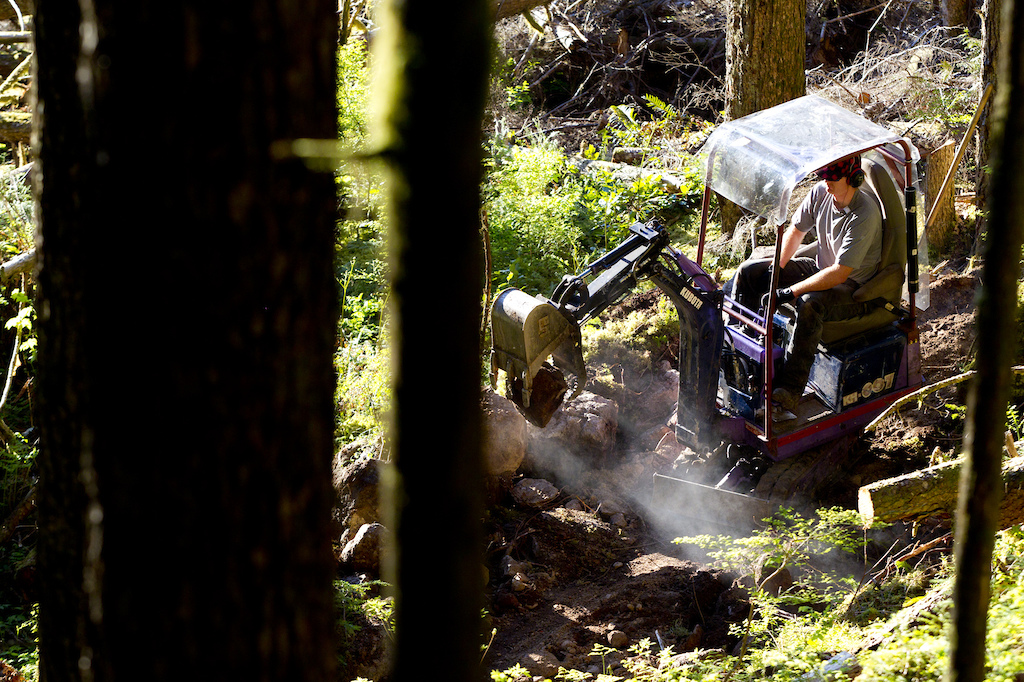 Ted Tempany building another trail in Squamish with the Mini Excavator. Photographer John Gibson