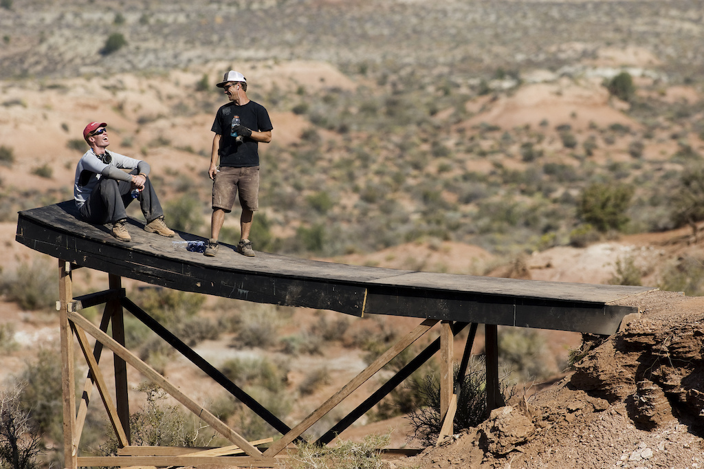 rider Course Builder Ted Tempany on left event Red Bull Rampage Training Day 1 location Virgin Utah USA Photographer John Gibson