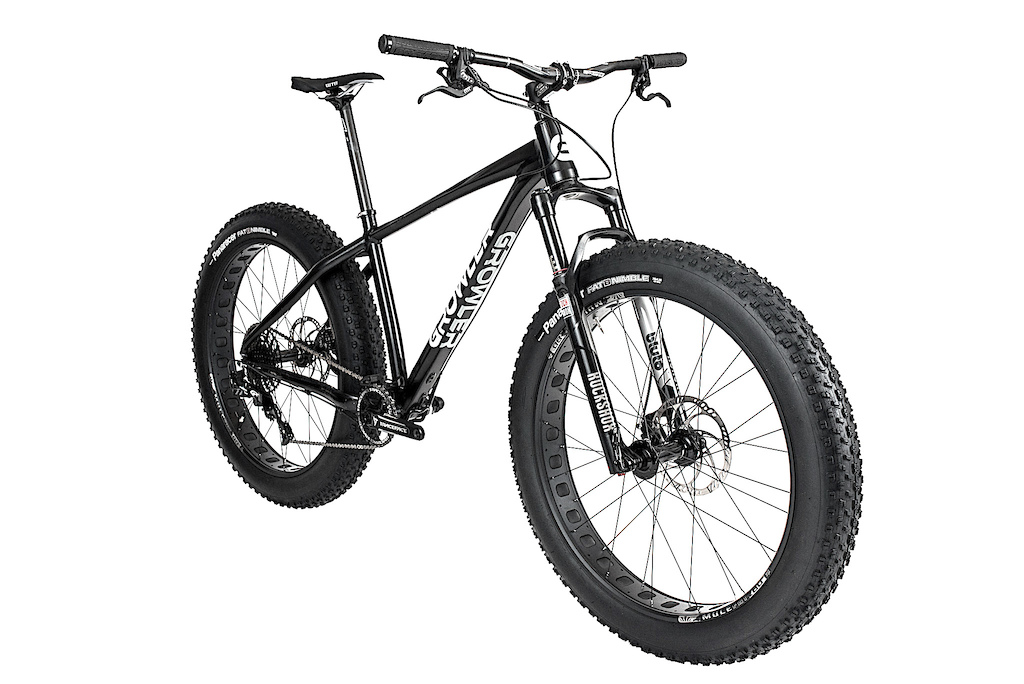 2017 Growler Mr. Big Stuff Performance Fat Bike.

PRODUCT INFO
Frame: Growler Mr. Big Stuff
Fork:  Growler Aluminum Fork with optional RockShox Bluto 100mm suspension fork
Headset: FSA Orbit integrated 1.125 - 1.5in 
Stem: FSA alloy with 31.8 Clamp 
Handlebar: FSA 740mm UD Carbon Fiber 1/2” rise/31.8 
Brakes: Magura MT5 4 Piston Hydraulic Brakes with 180mm Rotors front and rear  
Rear derailleur: SRAM GX 1x11, long cage 
Shift levers: SRAM GX trigger shifters
Cassette: SRAM, PG 1030 11-speed, 11-42t 
Chain: SRAM 1030 11 speed chain 
Crankset: Raceface Turbine Fat Bike Crank, 190mm spindle with 32T Chain Ring 
Rims: Sunringle Mulefut SL80 Tubeless installed  
Front Hub: Sunringle SRC 15x150mm hub
Rear Hub: Sunringle SRC 12x197mm hub 
Front tire: Panaracer Fat B. Nimble, 120TPI, folding bead, 26x4" 
Rear tire: Panaracer Fat B. Nimble, 120TPI, folding bead, 26x4"
Saddle: WTB Volt Comp saddle 
Grips: Answer Fall Line XC 
Seatpost: FSA 400mm UD Carbon Fiber Seatpost