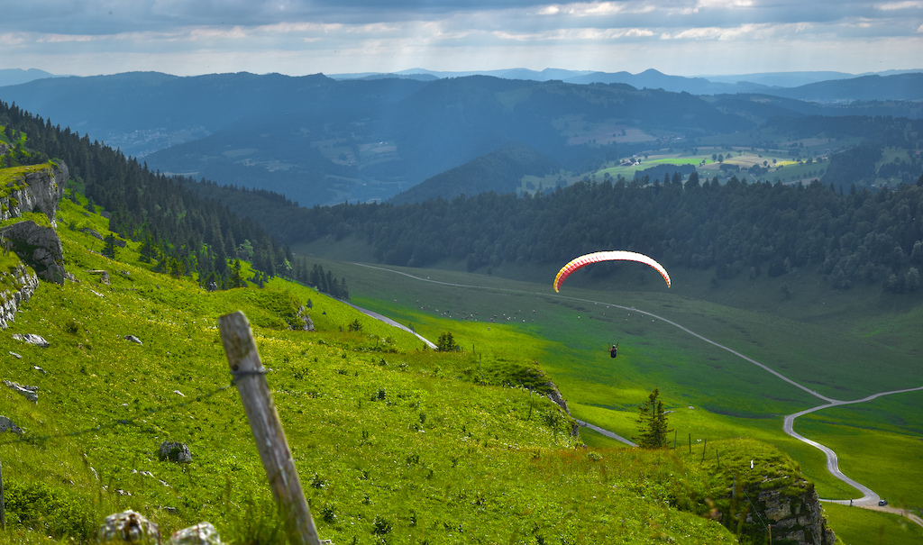Zacharie Couret chilling on his paraglider in Switzerland