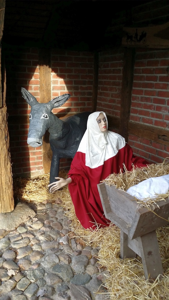 Local country folks' piety, baby Jesus in a manger
