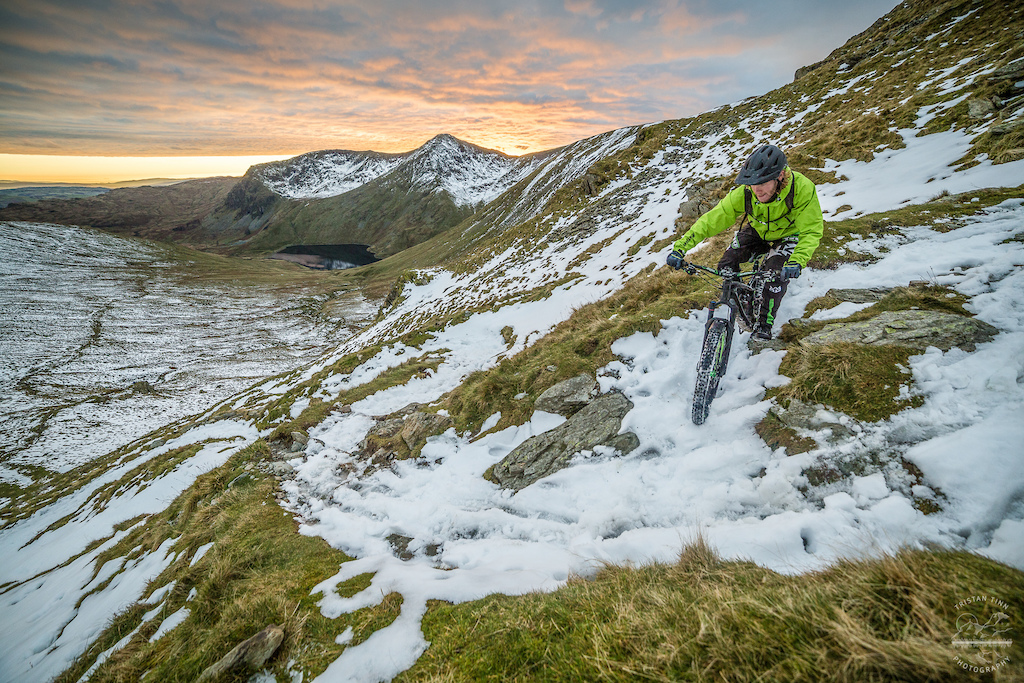 Descending the snow laiden switchbacks as the sky ignited. Proper winter riding!
