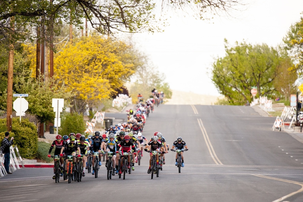 The men's field bombs down a hill during the Fat Tire Crit Friday.