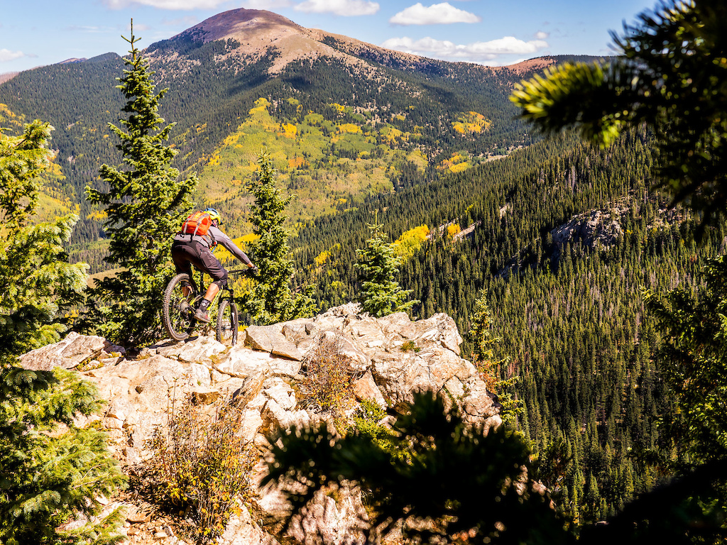 Mike Chapman (owner of The Broken Spoke) takes a frightening line overlooking Nambe Lake and Santa Fe Baldy.