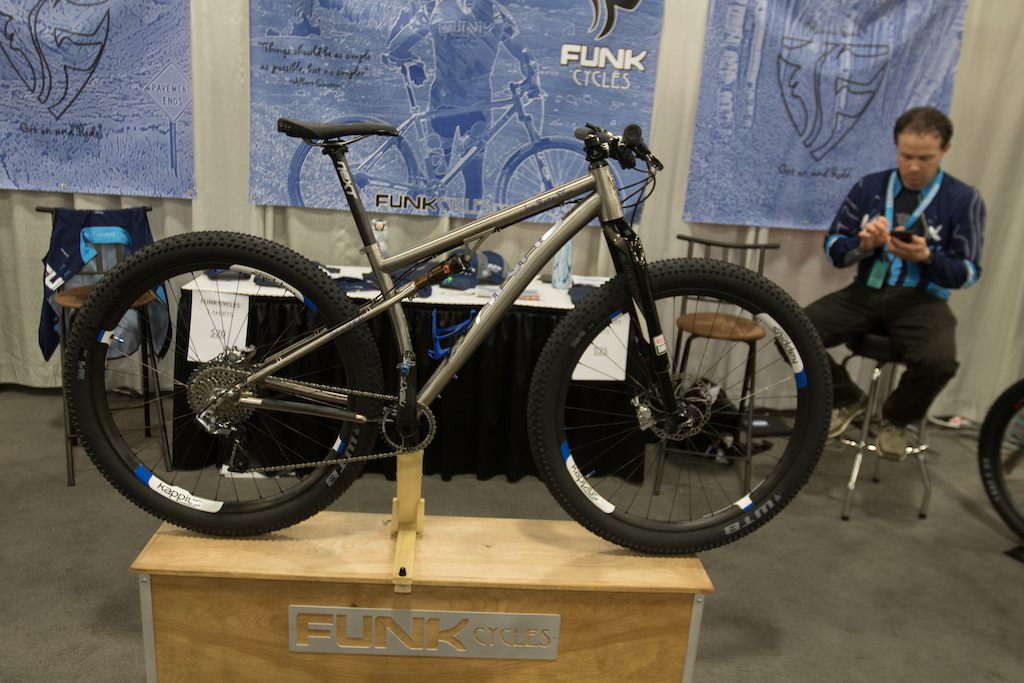 Funk Cycles 29 plus titanium bike has a 1.5 inch travel rear end that is made up of a solid chain stay. The lower chain stay acts as a leaf spring and because it s made of titanium it has the ability to flex and not lose its strength over time.