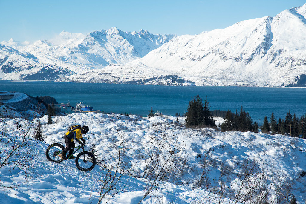 Simon Bosman descending with Port Valdez in the background. The Trans-Alaska Pipeline crosses Alaska from north to south where it transports crude oil from northern oil fields to Valdez at its southern terminus before oil tankers then take the crude oil to destinations around the world.
