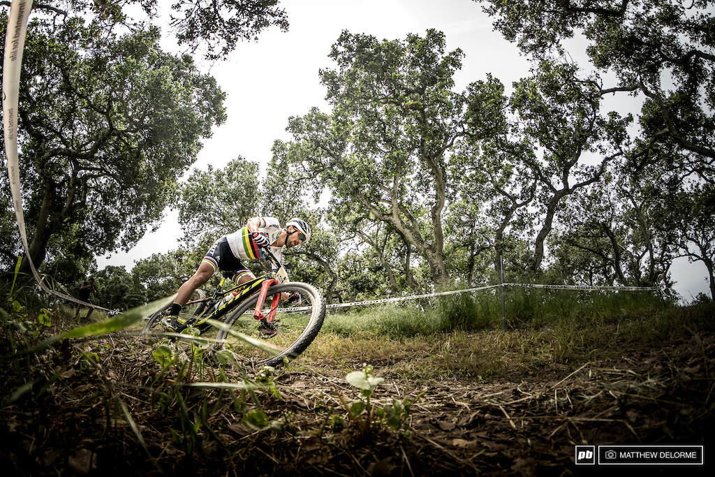 Nino Schurter leans it hard in the "woods".