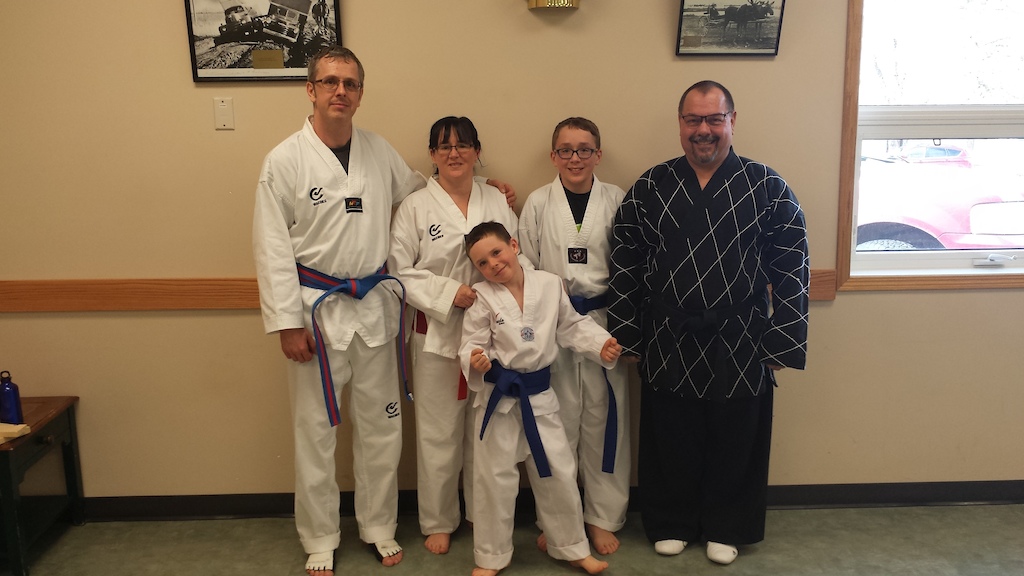 Everyone passed promotions with little difficulty. Blue belts for the kids, red stripes for mom and dad.
