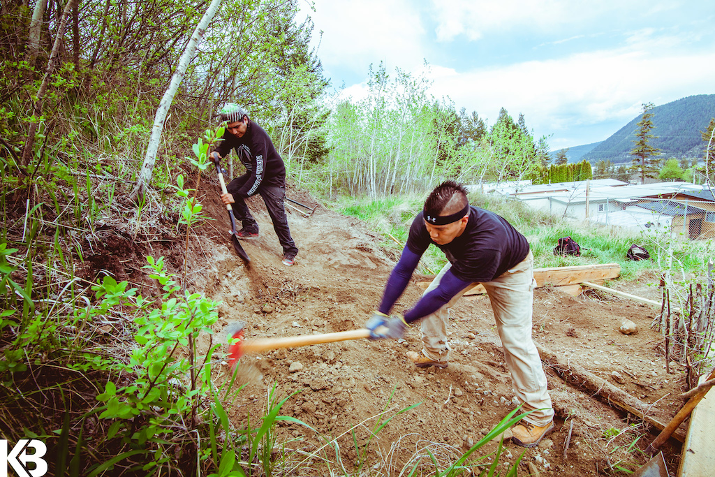 The Xats'ull First Nation Pro Trail Crew working on the Fox Mountain SPG reroute trail with First Journey Trails foreman Mitch Forbes.