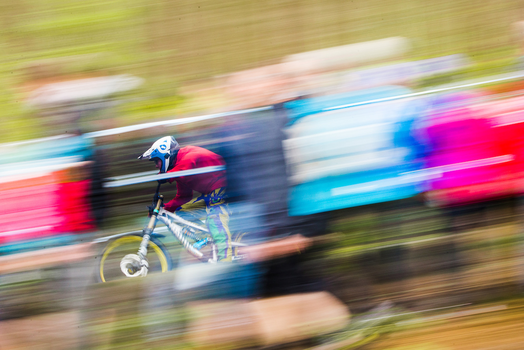 Speed blur through the endless wall of spectators.