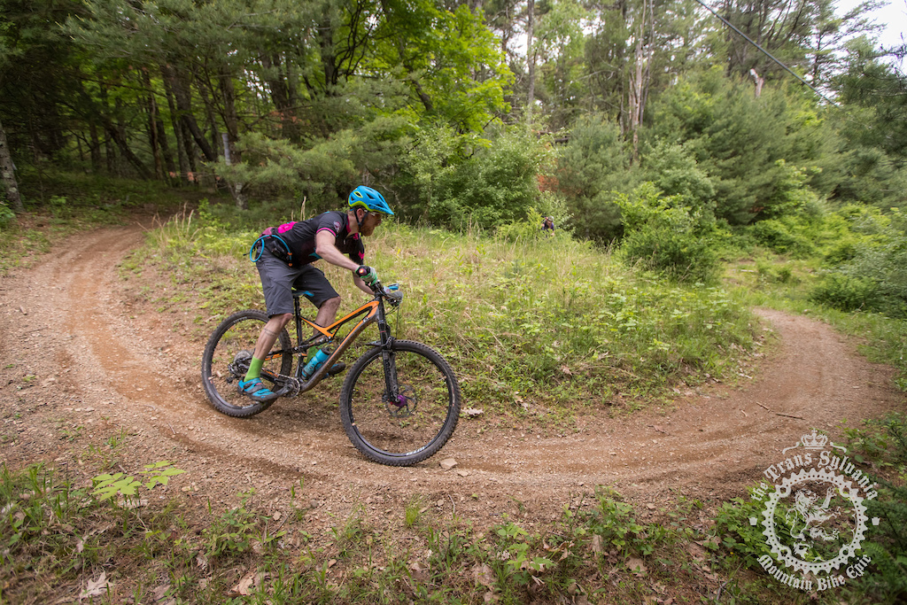 A rider flies down the final enduro segment of stage 3 of the NoTubes Trans-Sylvania Epic.
