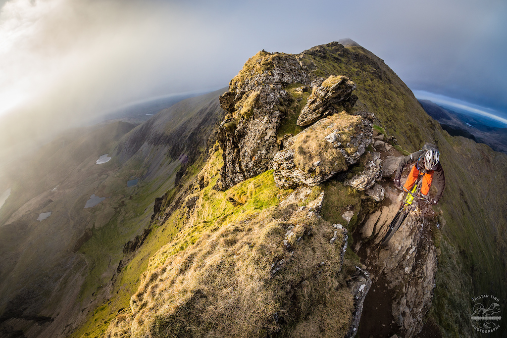 Every now and again all the perseverance and patience pays off.
 
This was one of those moments - one of those memories that keeps me going back for more. More mountains, more searching for the elusive light, to emphasise the mood you strive to portray. The search takes you to the ends of the day, standard routine must be broken.
 
This is a shot myself and Pete (rider) have kept tucked away for a while now, I'm sure he'll be as relieved to see it live as I am.
 
Rhyd Ddu ridgeline off the summit of Snowdon. Certainly a descent to keep you on your toes! See a similar version to this image in this months MBR.
 
What's the most exposed trail you've ridden?