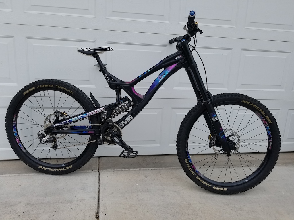 Galaxy themed Intense M16A. Decals by PB user NLDESIGNS. 
Large Aluminum Frame
Fox 40 Performance Elite Fit4 damper black stanchions
Fox RC4 shock with Ti spring, Kashima coat.
Deity Cockpit
Saint Brakes and Derailleur 
MTX33 wheels
RaceFace Cranks