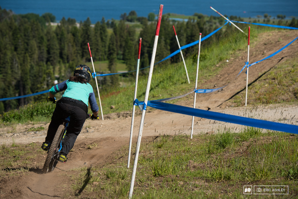 Kerstin Holster heads into the grassy off-camber section at the bottom of the course Pro Women .