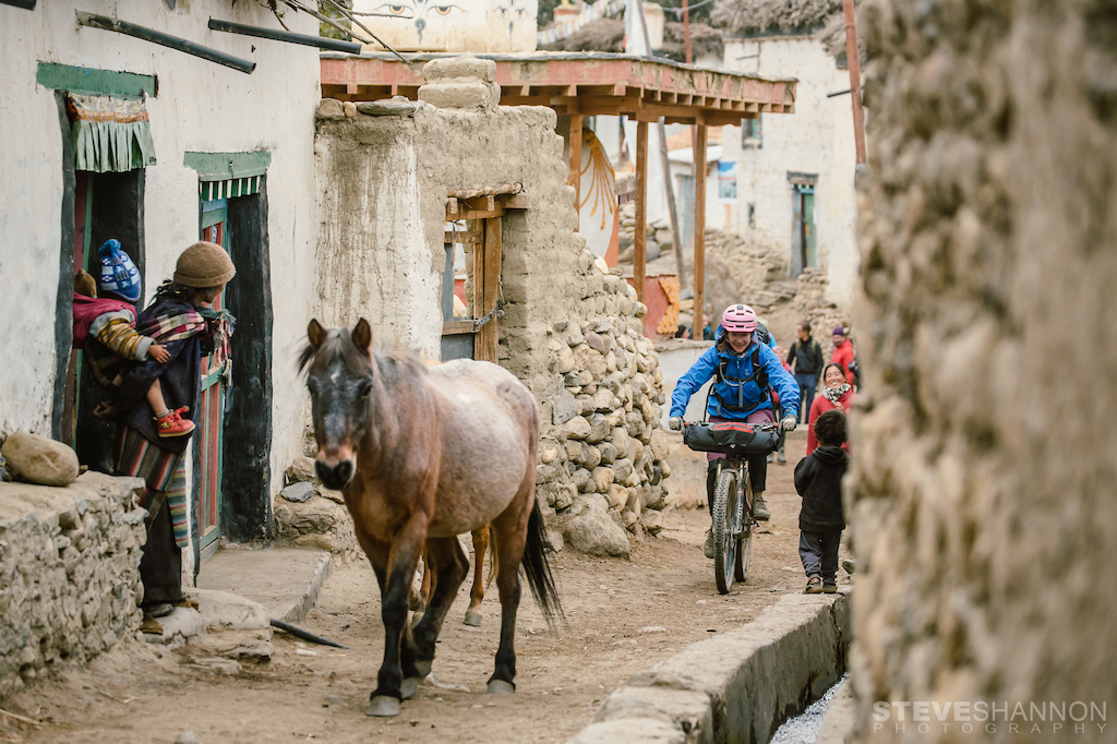 Riding through the village of Ghami, Upper Mustang, Nepal.