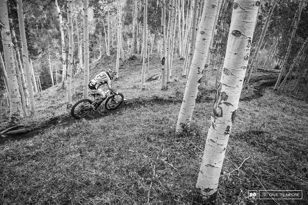 Jerome riders the dirt ribbon between the aspens on stage 2.