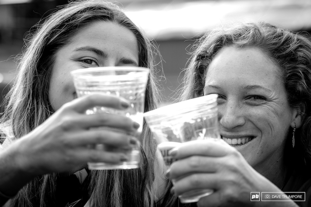 Isabeau Courdurier and Noga Korem rehydrate with some cold beer after a very long and hot weekend of racing in Aspen.