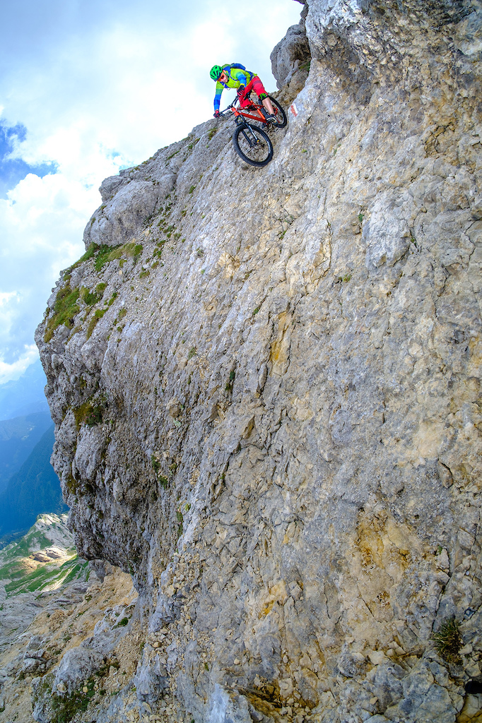 Steep riding in a no fall zone coming down from the Latemar sptize, Dolomites.
