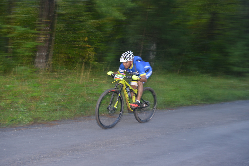 It's all about getting aero as rider Carlos Espinoza hammers down on the cranks. The knobbies even get to see a bit of road action as well. #Shenandoah100 #StokesvillePhoto by Bob Popovich www.bobs-photogallery.com