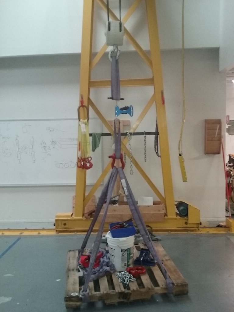 Tensiometer calibration rig 2017.  Last year it was a bunch of dumbells hanging from a rope tied to an exercise machine.  This year I happen to have this 5 ton crane and rigging laying around...  Weighed the pallet, rigging and crap on it individually @100kg on a trusted scale
